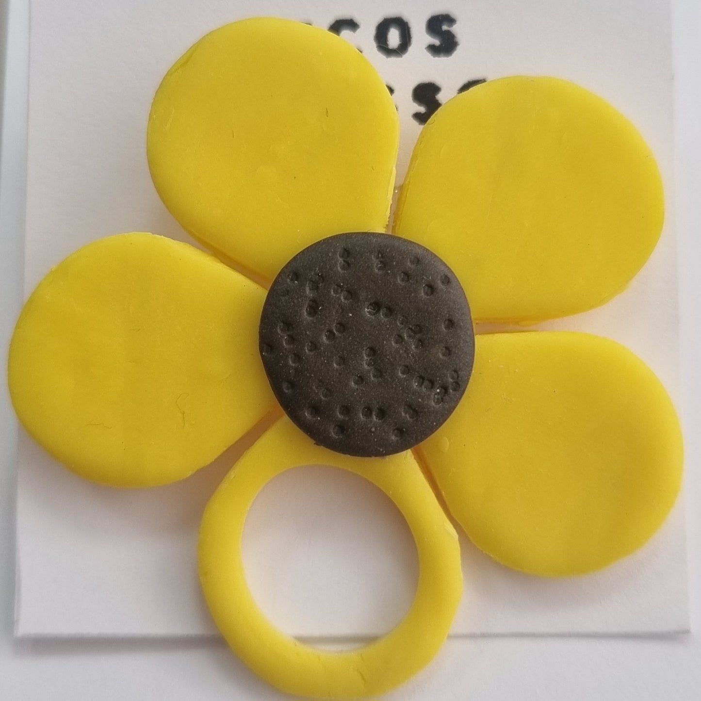 Broche cuelga gafas flor amarilla